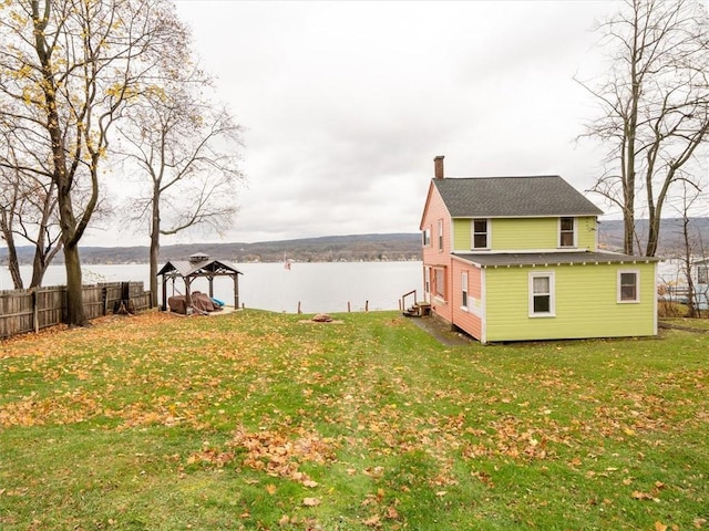 view of yard with a gazebo and a water view