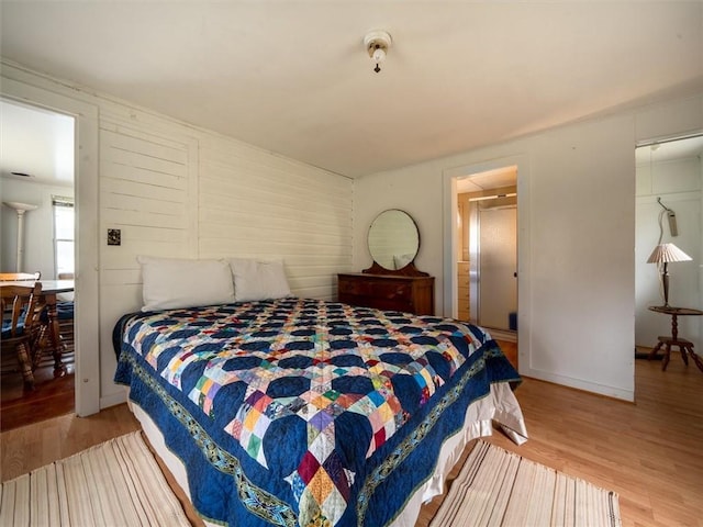 bedroom featuring light hardwood / wood-style floors and a closet