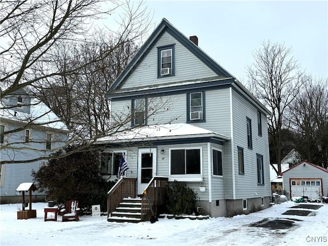 front of property with an outbuilding and a garage