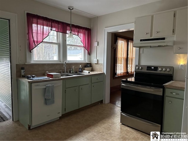 kitchen with dishwasher, stainless steel range with electric cooktop, sink, hanging light fixtures, and white cabinetry