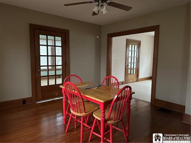 dining area featuring ceiling fan, french doors, and dark wood-type flooring