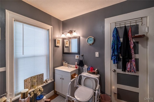 bathroom featuring vanity and a textured ceiling