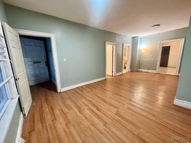 spare room featuring light wood-type flooring