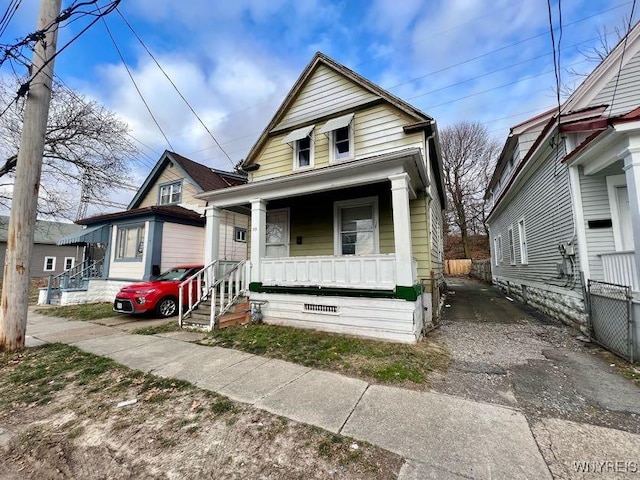 bungalow-style house featuring covered porch