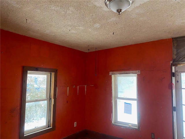 spare room featuring a textured ceiling