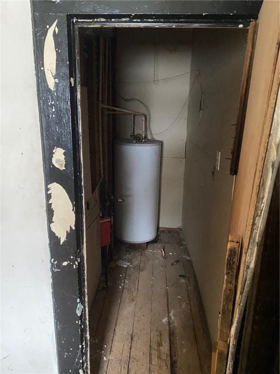 utility room featuring water heater