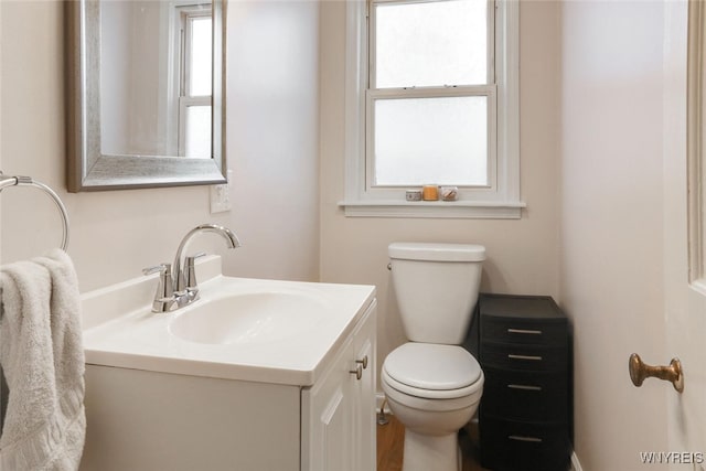 half bath with vanity and toilet