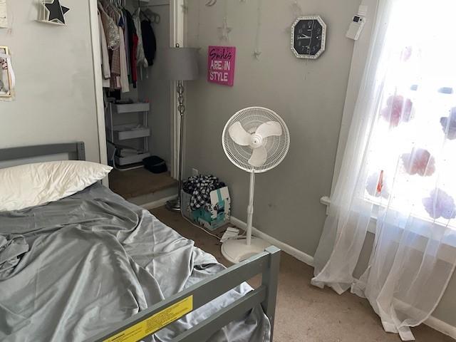 carpeted bedroom featuring a closet