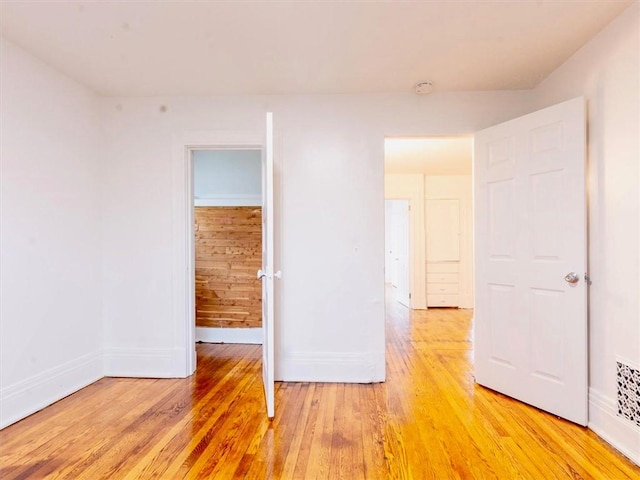 unfurnished bedroom featuring hardwood / wood-style floors