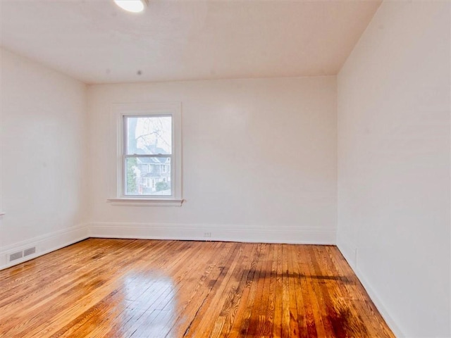 unfurnished room featuring light hardwood / wood-style flooring