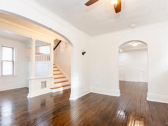 unfurnished room with dark hardwood / wood-style floors, ceiling fan, and crown molding