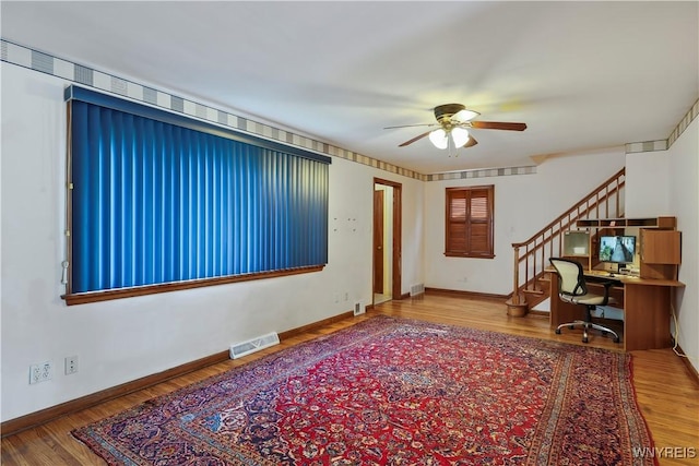 interior space featuring ceiling fan and hardwood / wood-style floors