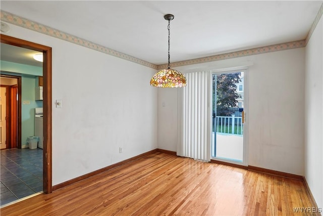 unfurnished dining area featuring hardwood / wood-style flooring