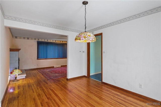 unfurnished dining area with hardwood / wood-style flooring