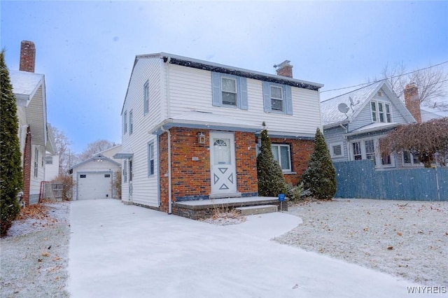 view of front property featuring a garage and an outdoor structure