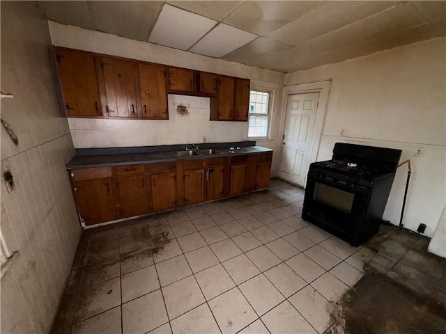 kitchen with sink and black gas range oven