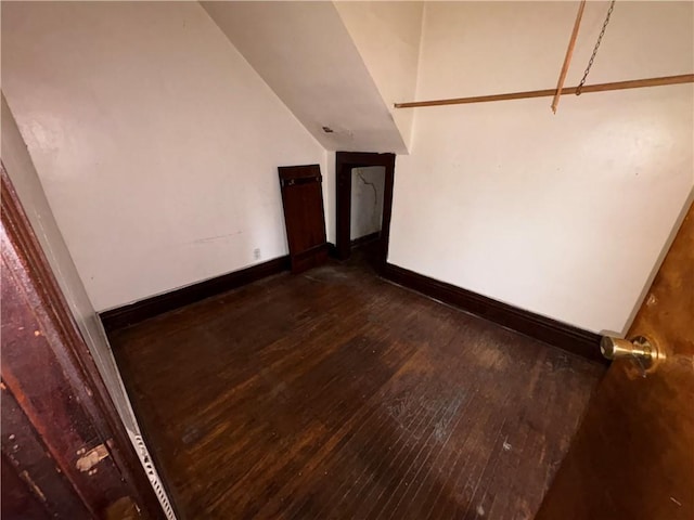 spare room with dark hardwood / wood-style flooring