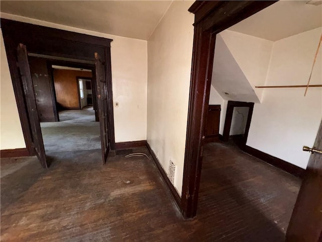 hall with dark hardwood / wood-style flooring