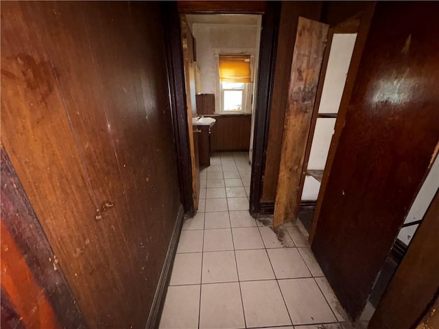 hallway with light tile patterned floors