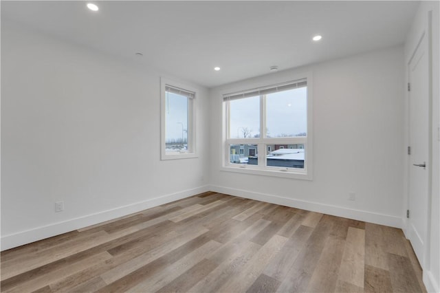 empty room with light hardwood / wood-style floors