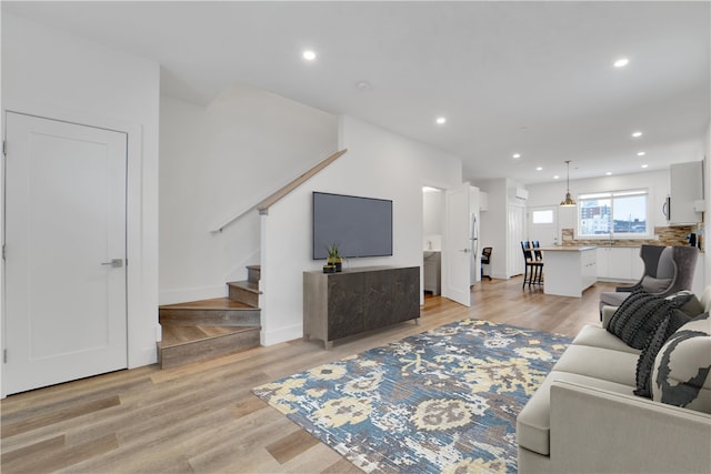 living room with light hardwood / wood-style flooring