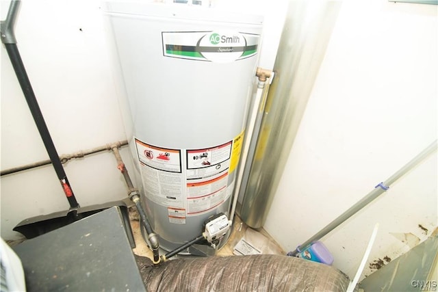 utility room featuring water heater