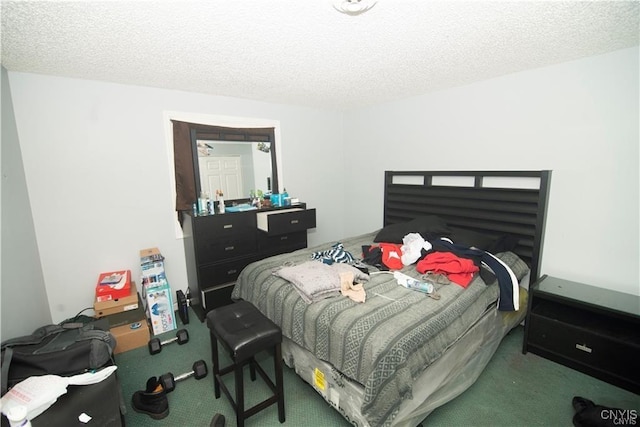 bedroom with carpet flooring and a textured ceiling