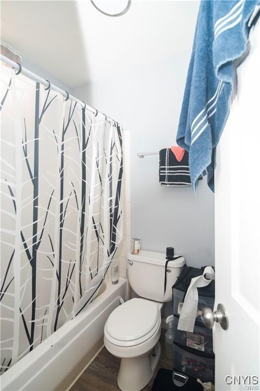 bathroom featuring shower / bath combo, toilet, and wood-type flooring