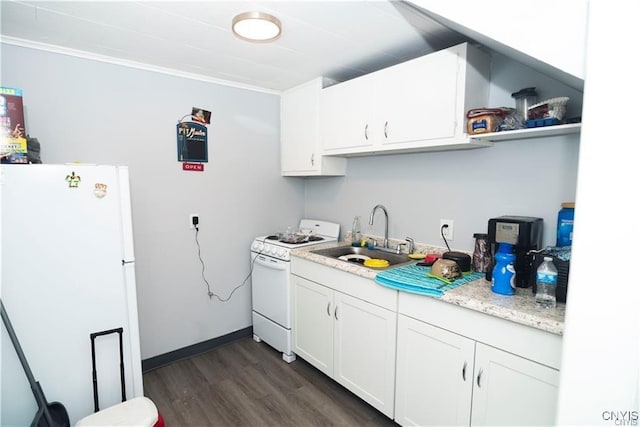 kitchen with sink, white cabinets, dark hardwood / wood-style floors, and white appliances