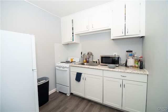 kitchen with white cabinetry, sink, dark hardwood / wood-style floors, and white appliances