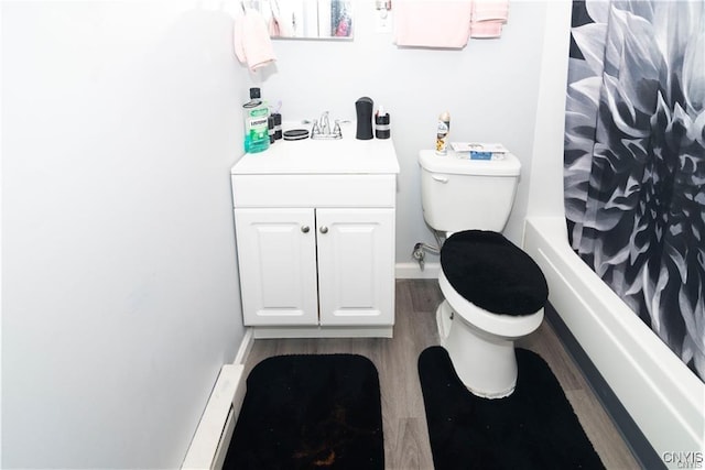 full bathroom with hardwood / wood-style floors, shower / bath combination with curtain, toilet, and vanity