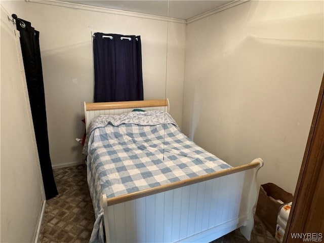 carpeted bedroom with ornamental molding