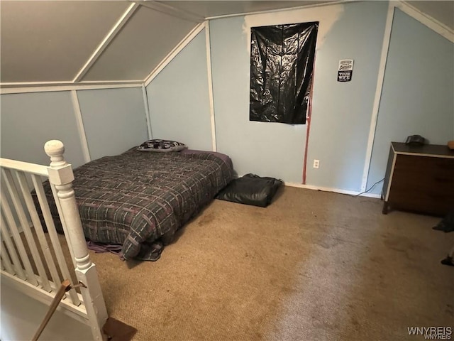 carpeted bedroom featuring lofted ceiling