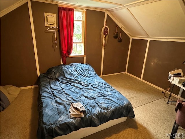 bedroom featuring carpet floors and vaulted ceiling