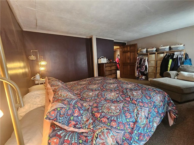 bedroom with carpet and a closet