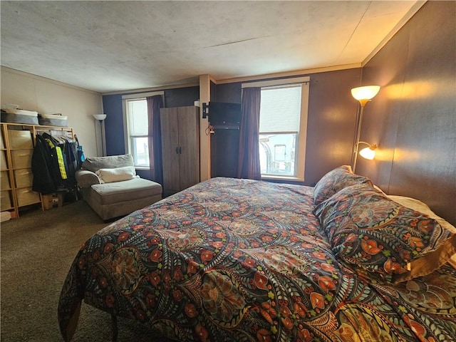 bedroom with crown molding and carpet floors