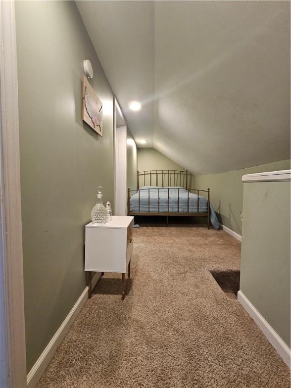 bedroom with carpet and vaulted ceiling