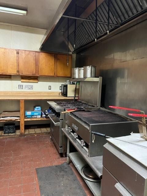 kitchen featuring high end stainless steel range oven