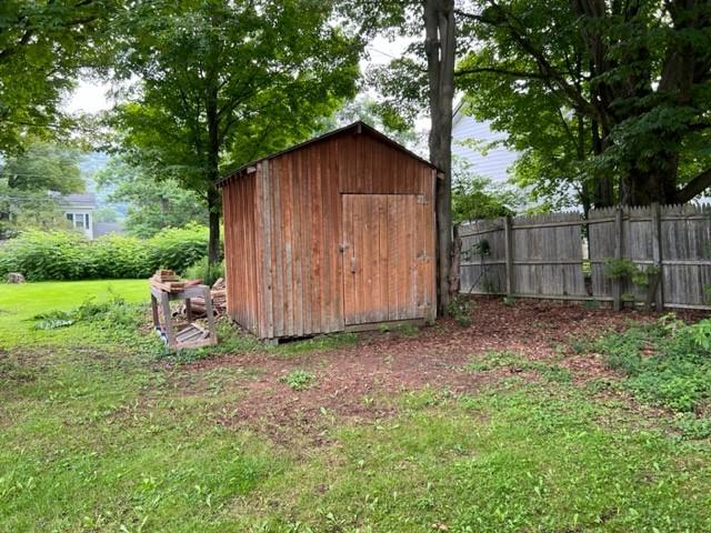 view of outdoor structure with a lawn