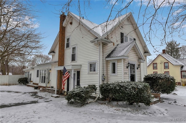 view of snow covered house