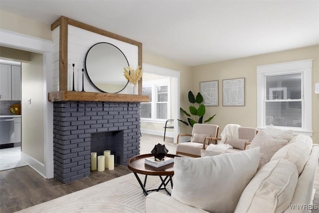 living room featuring a fireplace and dark hardwood / wood-style floors