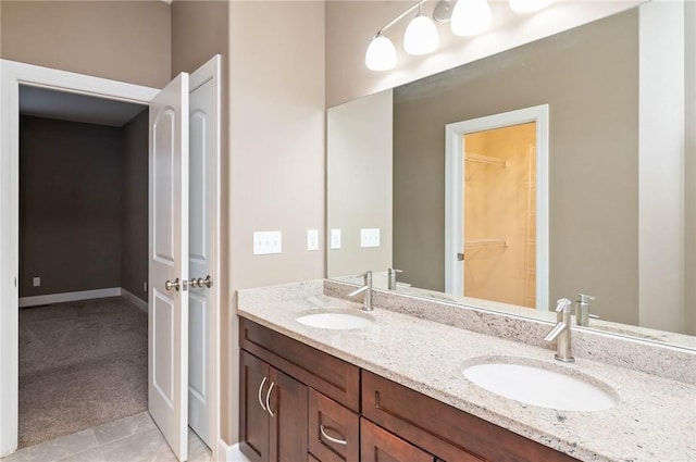 bathroom with tile patterned flooring and vanity