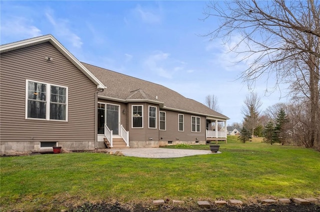 back of house featuring a yard and a patio