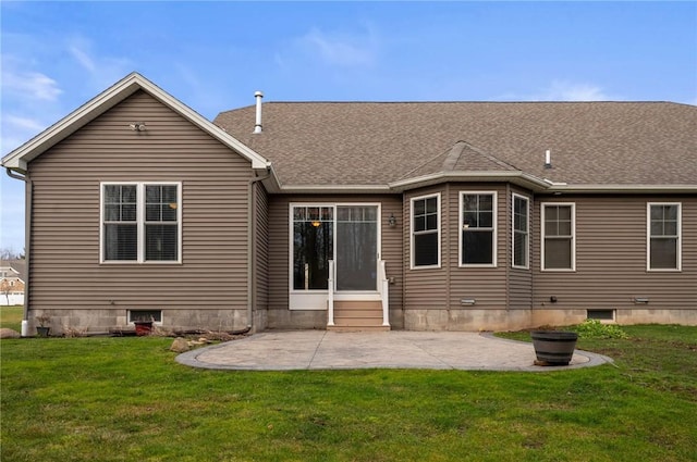 back of house with a lawn and a patio area