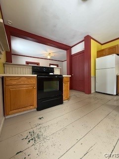 kitchen with white refrigerator and electric range