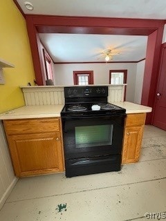 kitchen with black range with electric stovetop and kitchen peninsula