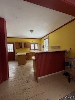 kitchen featuring kitchen peninsula, a kitchen island, and pool table