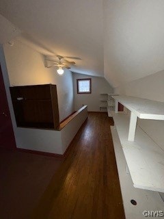 bonus room with lofted ceiling, ceiling fan, and dark wood-type flooring