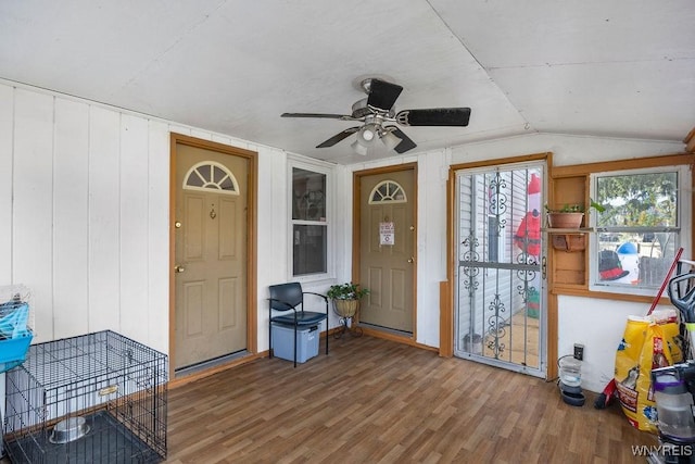 entrance foyer with hardwood / wood-style flooring, ceiling fan, and vaulted ceiling