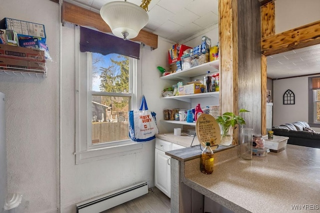 laundry area featuring a baseboard radiator